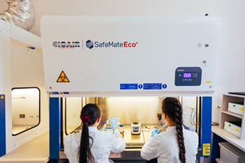 Two researchers working at a SafeMateEco lab unit